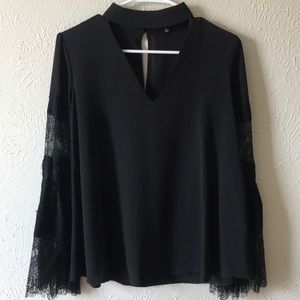 Lulus black long sleeve top with lace detailing.